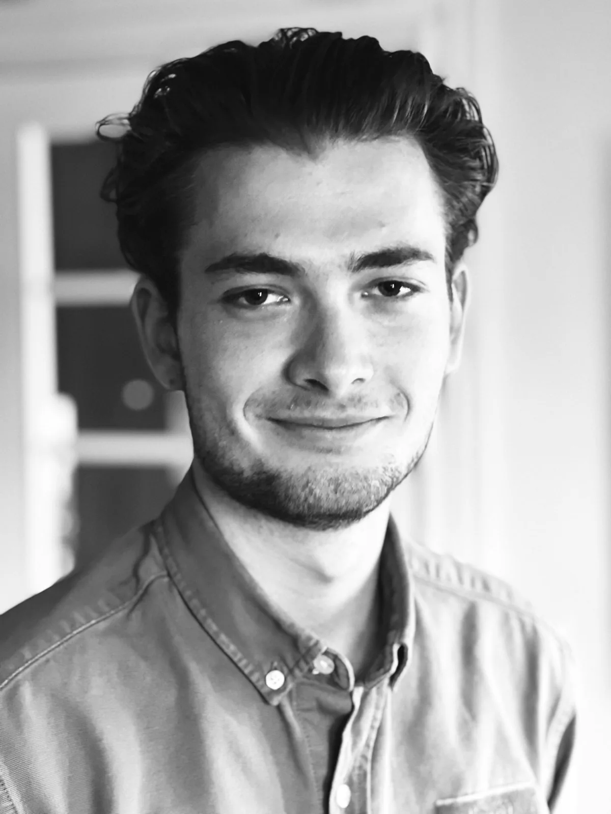 Portrait of Hugo in a denim shirt, black and white